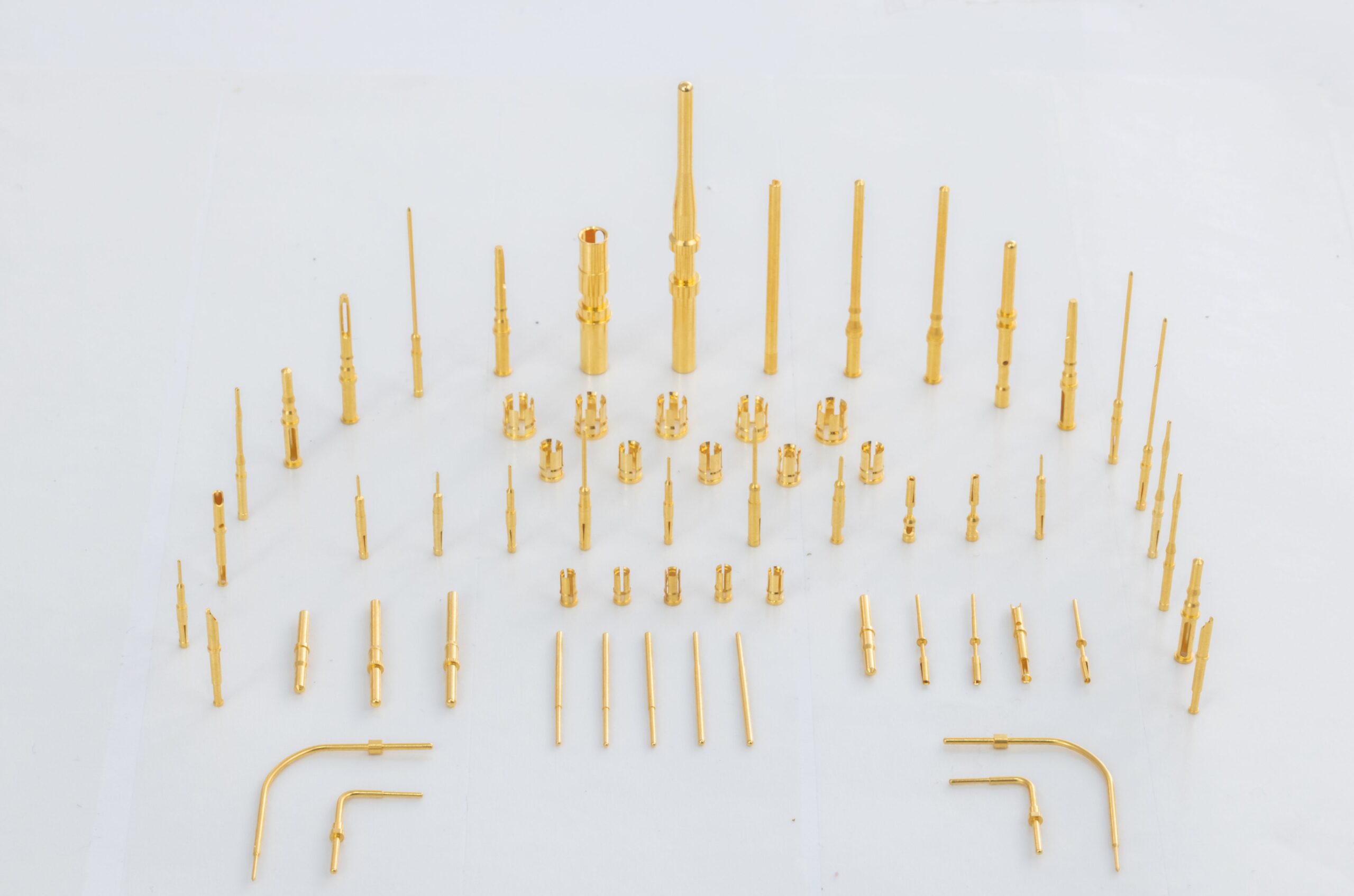 Gold-plated connector pins machined by AVF Decolletage and plated by qualified suppliers in Singapore and the USA.