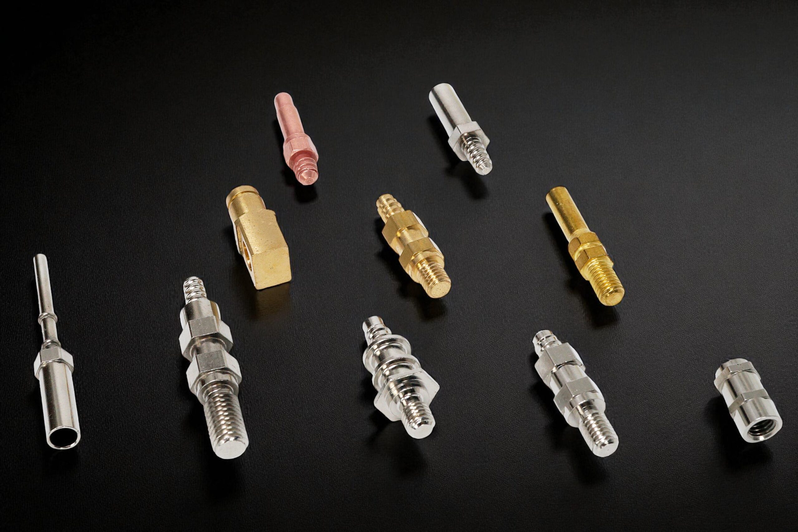 Automotive and motorcycle precision parts manufactured by AVF Decolletage using Swiss CNC machining.